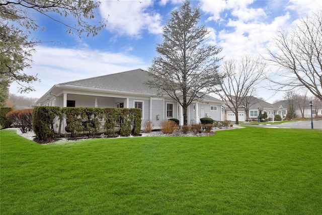 rear view of house with a lawn