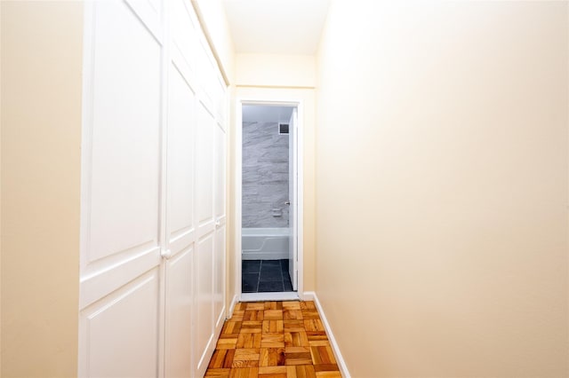 hallway featuring light parquet flooring