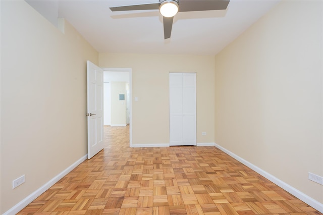 interior space featuring ceiling fan and light parquet flooring