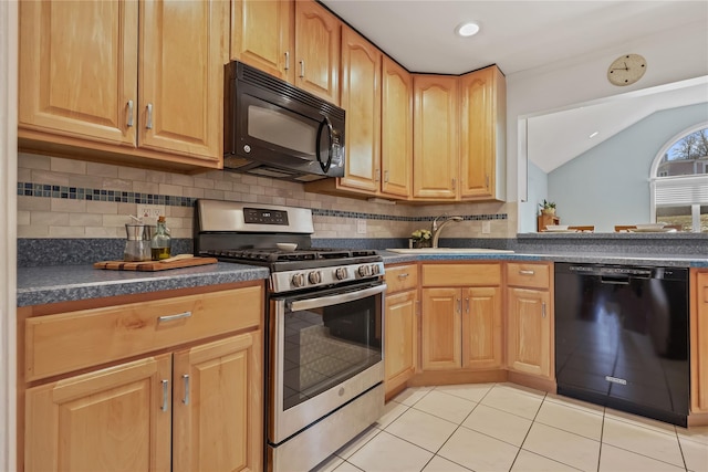 kitchen featuring lofted ceiling, sink, backsplash, light tile patterned floors, and black appliances