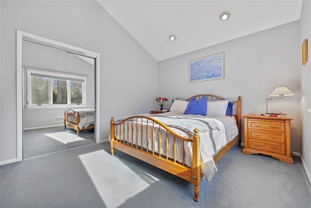 carpeted bedroom featuring lofted ceiling