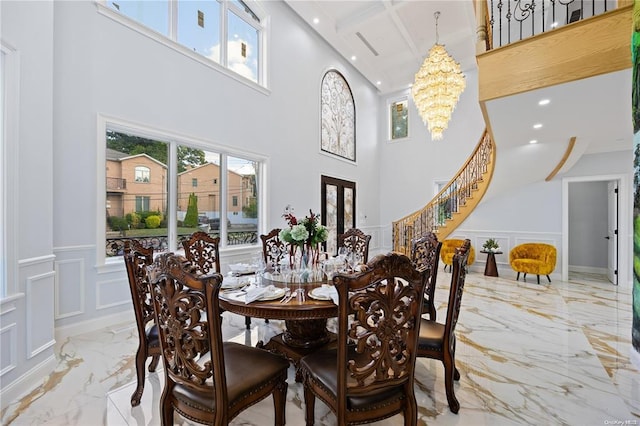 dining area featuring a healthy amount of sunlight and a notable chandelier