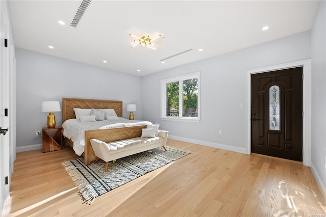 bedroom with light wood-type flooring