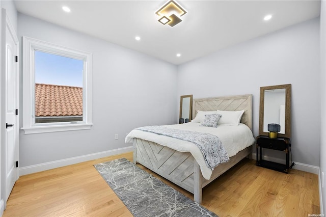 bedroom with wood-type flooring