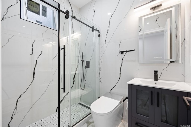 bathroom with a shower with door, vanity, and toilet