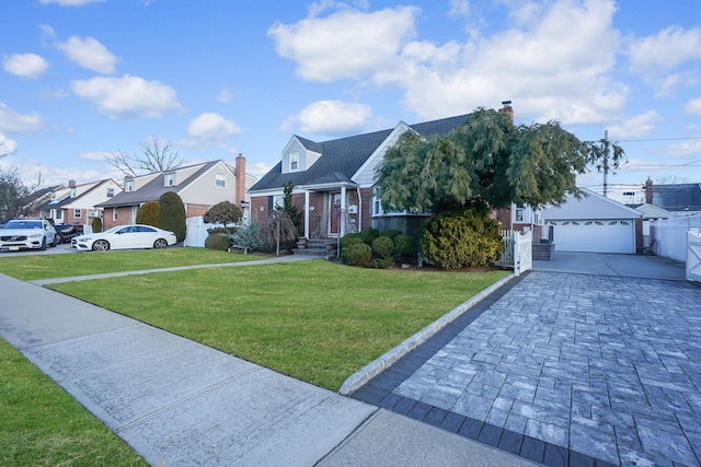 view of front of home with a garage and a front lawn