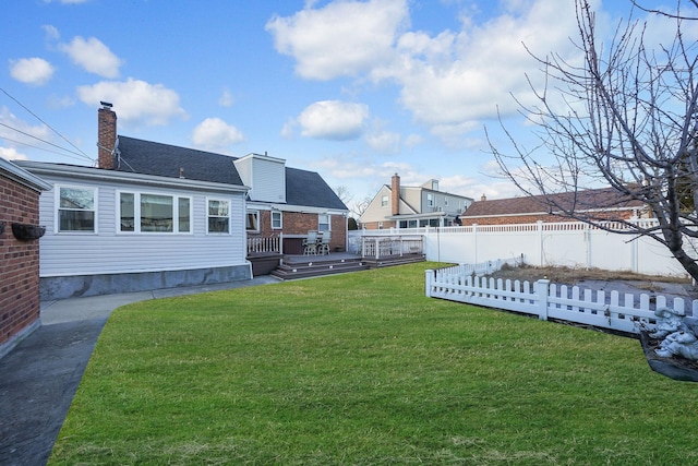 view of yard featuring a wooden deck