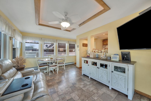 living room with cooling unit, ceiling fan, and a raised ceiling