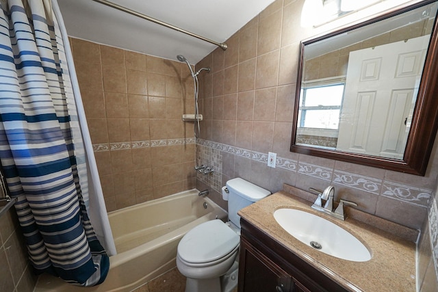 full bathroom featuring vanity, toilet, tile walls, and shower / bath combo with shower curtain