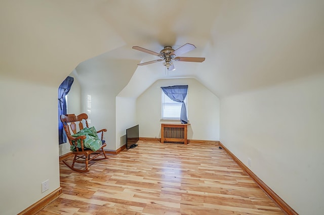 bonus room featuring ceiling fan, vaulted ceiling, and light hardwood / wood-style flooring