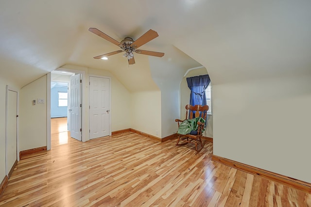 additional living space with vaulted ceiling, ceiling fan, and light hardwood / wood-style floors