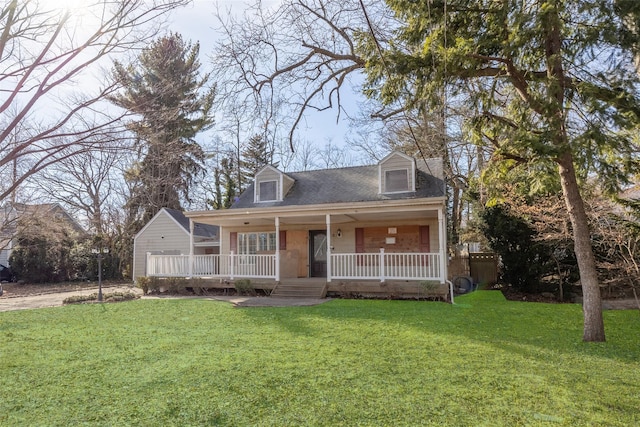 view of front of property featuring a front lawn and covered porch