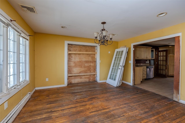 unfurnished dining area with dark hardwood / wood-style flooring, an inviting chandelier, and baseboard heating