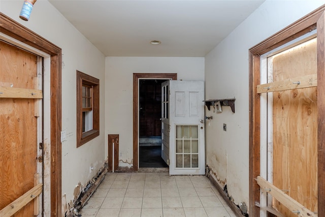 hallway with light tile patterned floors