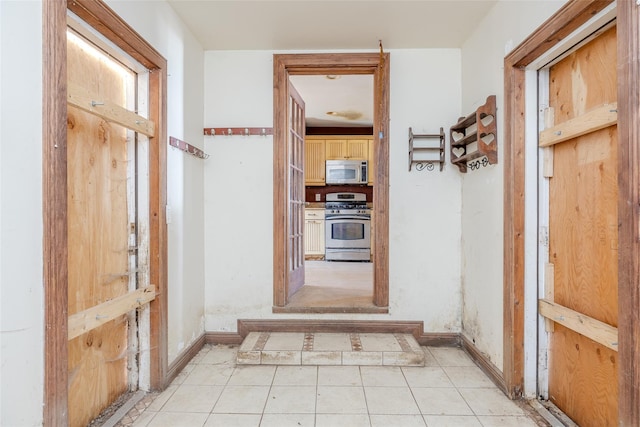 hallway featuring light tile patterned floors