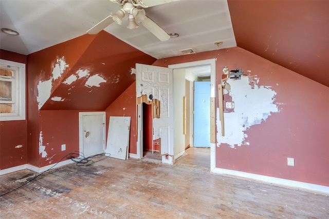 additional living space with lofted ceiling and ceiling fan