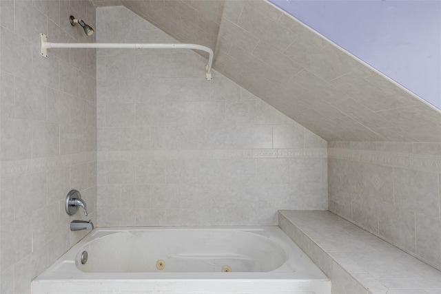 bathroom with lofted ceiling