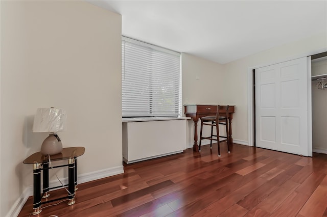 bedroom featuring dark wood-type flooring