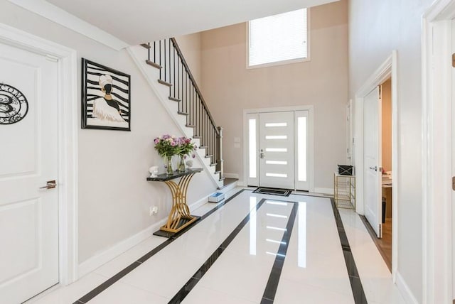 entryway with a high ceiling