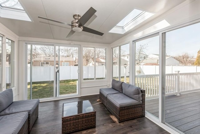 sunroom featuring plenty of natural light and a skylight