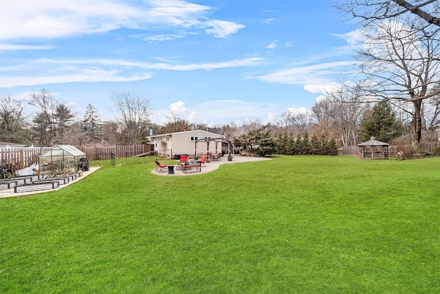 view of yard with a gazebo, a patio area, and a fenced backyard