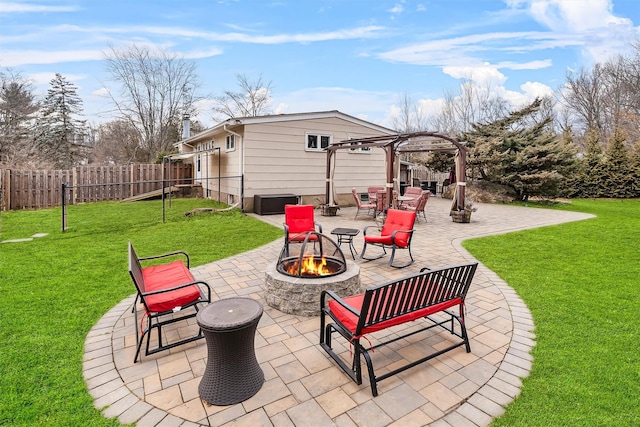 view of patio / terrace featuring an outdoor fire pit, fence, and a pergola