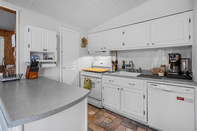 kitchen featuring under cabinet range hood, white appliances, a sink, white cabinetry, and vaulted ceiling