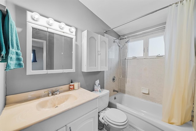 bathroom featuring toilet, shower / bathtub combination with curtain, and vanity