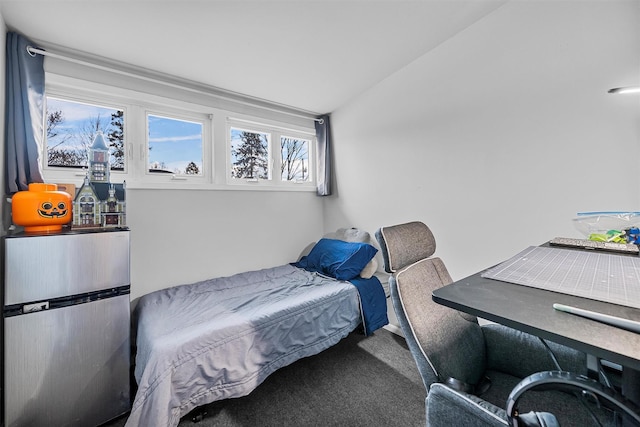 carpeted bedroom featuring lofted ceiling