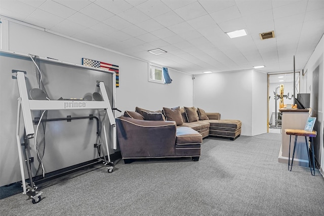 living area with carpet floors and visible vents