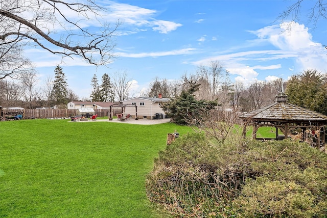 view of yard with a gazebo, a patio, and a fenced backyard