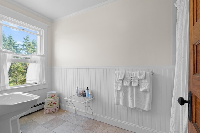 bathroom with tile patterned flooring, crown molding, and a baseboard heating unit