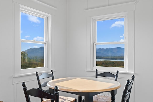 dining area with plenty of natural light and a mountain view