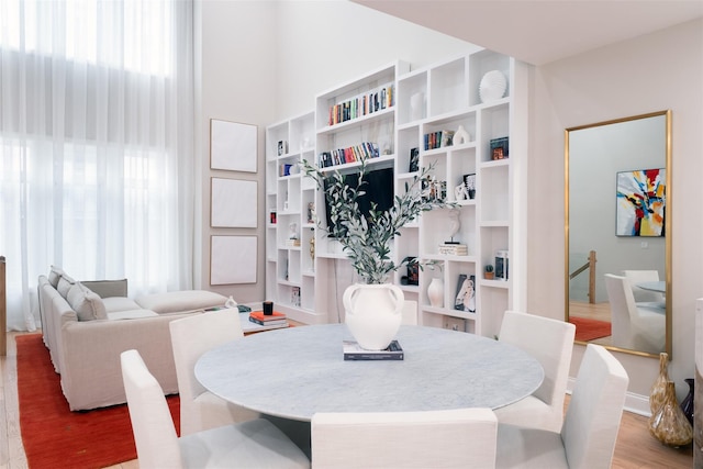 dining space with light wood-type flooring