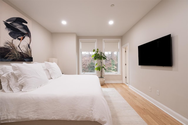 bedroom with light hardwood / wood-style floors