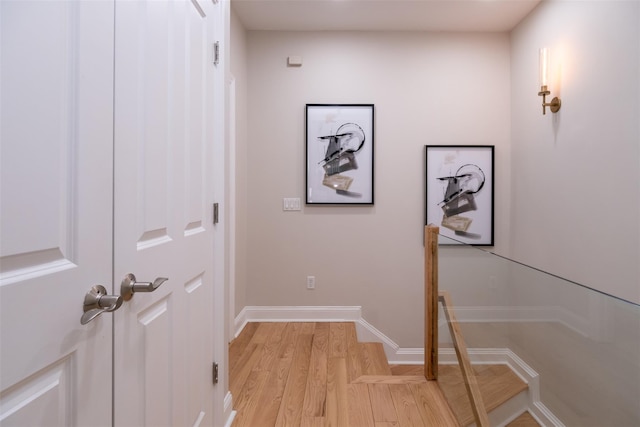 hall with light hardwood / wood-style flooring