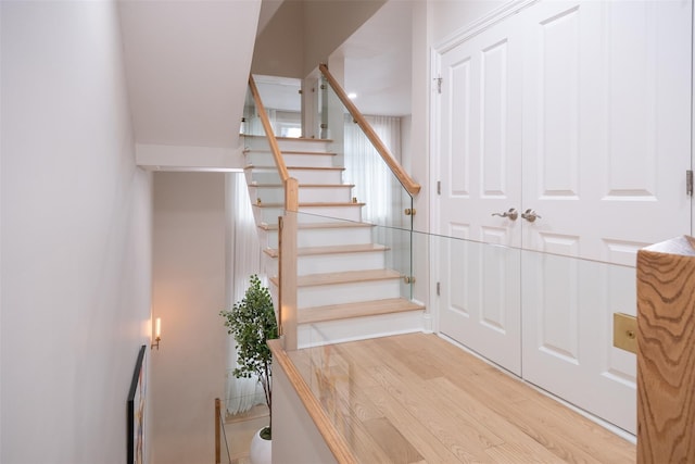 staircase featuring hardwood / wood-style flooring