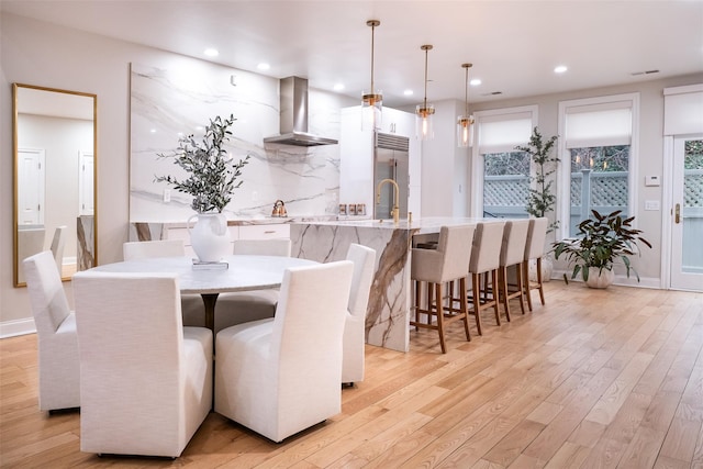 dining space featuring light hardwood / wood-style floors