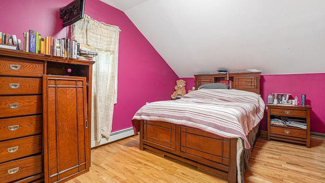 bedroom featuring a baseboard radiator, vaulted ceiling, baseboards, and light wood-style flooring