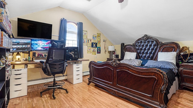 bedroom featuring light wood-style floors, vaulted ceiling, and baseboard heating