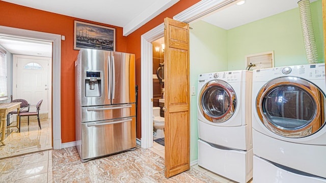 washroom featuring independent washer and dryer