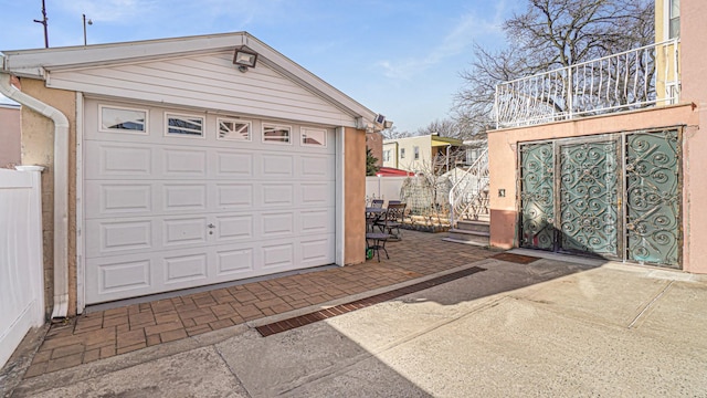 garage with fence