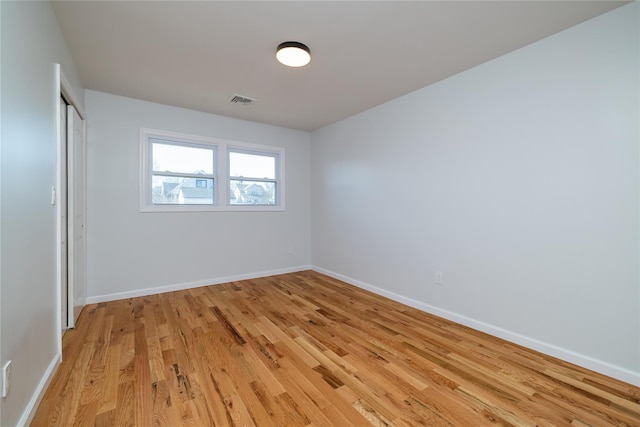 empty room with light wood-type flooring