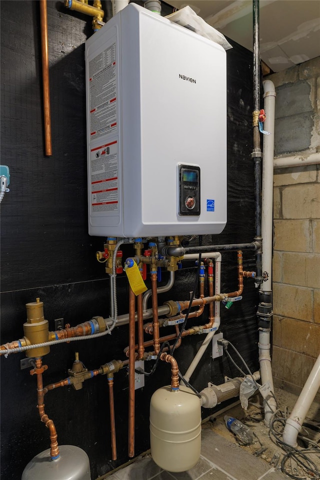 utility room featuring water heater