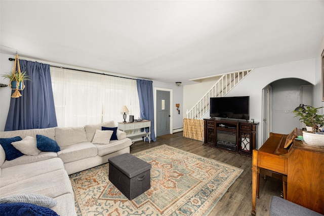 living room with a baseboard radiator and dark hardwood / wood-style floors