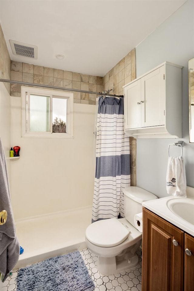 bathroom with vanity, toilet, and a shower with curtain