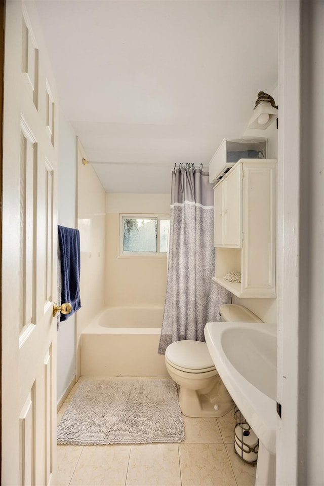 full bathroom with sink, tile patterned floors, toilet, and shower / tub combo