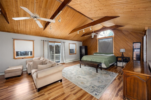 bedroom with multiple windows, wood ceiling, lofted ceiling with beams, and hardwood / wood-style flooring