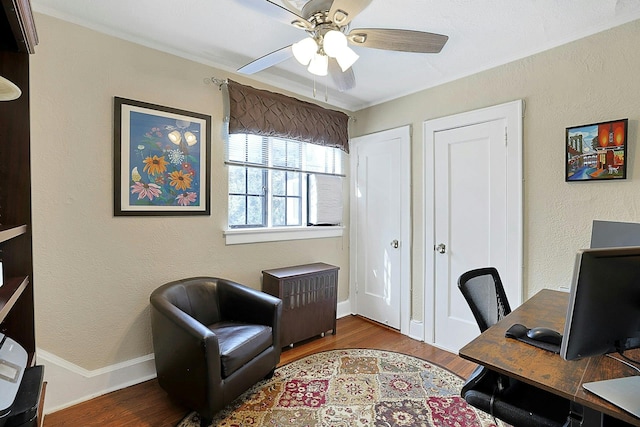 office area featuring ceiling fan, baseboards, and wood finished floors