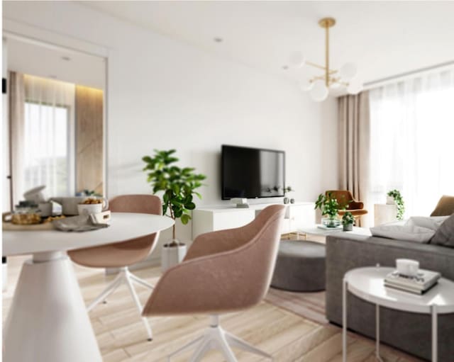 living room with an inviting chandelier and wood-type flooring